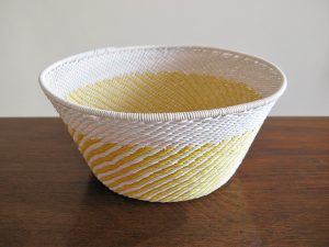 Marsha: Yellow and white hand-woven telephone-wire basket