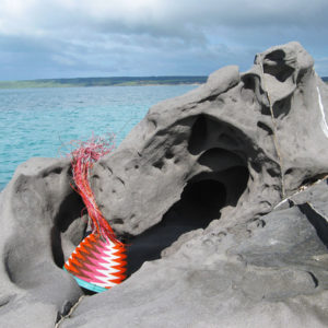 Chevron-patterned wire basket on weathered rocks at Antechamber Bay, Kangaroo Island.