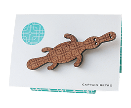 Duck-billed platypus brooch in Tasmanian Myrtle wood veneer with a delicate laser-engraved retro pattern of overlapping squares