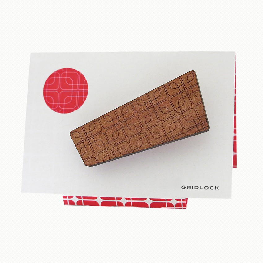 Gridlock patterned brooch in Tasmanian myrtle Brooch in Tasmanian Myrtle wood veneer, with a retro-inspired pattern of overlapping rounded-corner squares