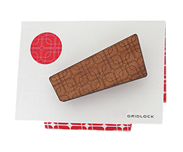 Brooch in Tasmanian Myrtle wood veneer, with a retro-inspired pattern of overlapping rounded-corner squares