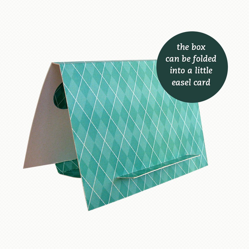 Patterned side of the easel/gift box for my Lucky Bunny brooch The brooch gift box can be folded out into an easel card with a bold turquoise argyle pattern