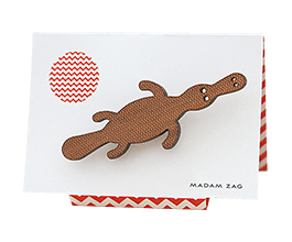 Duck-billed platypus brooch in Tasmanian Myrtle wood veneer with a delicate laser-engraved chevron pattern