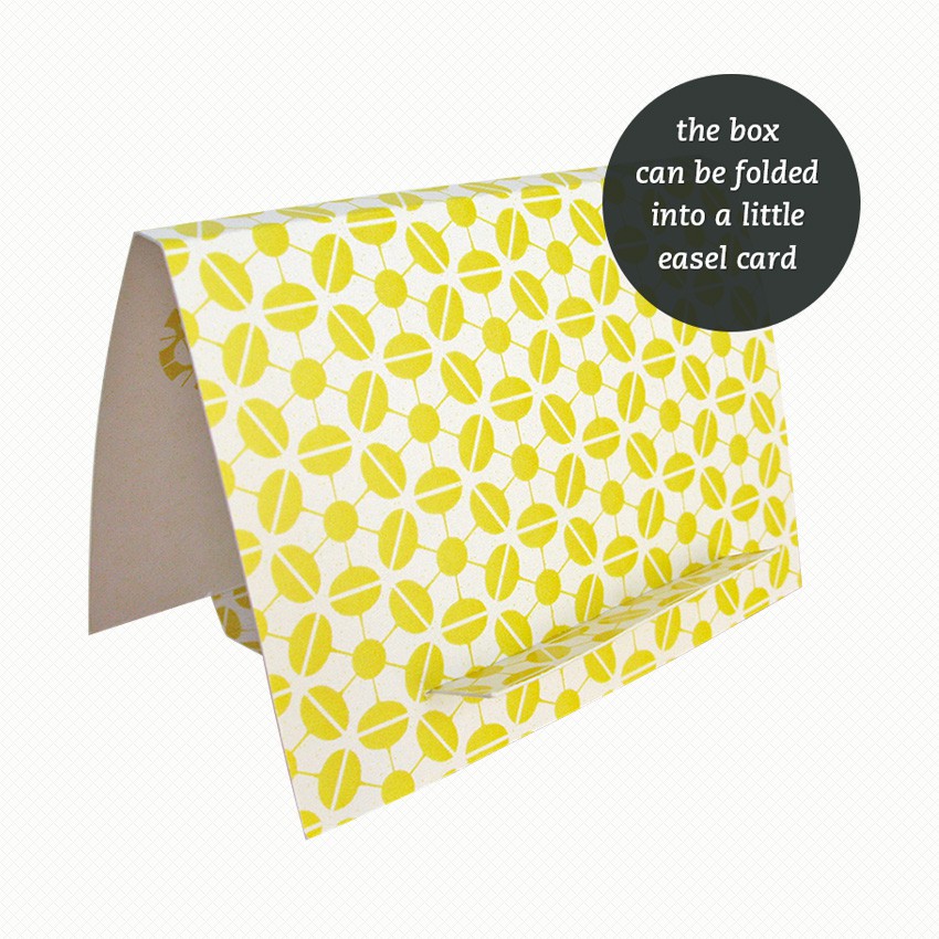 Patterned side of the easel/gift box for my Sputnik patterned brooch The brooch gift box can be folded out into an easel card with a matching pattern in yellow and white.