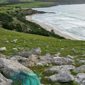Wire basket on the hilltops looking down to Stokes Bay beach, Kangaroo Island.