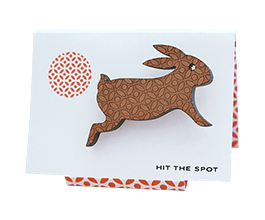 Enchanting rabbit brooch in Tasmanian Myrtle wood, laser-engraved with a delicate circle pattern