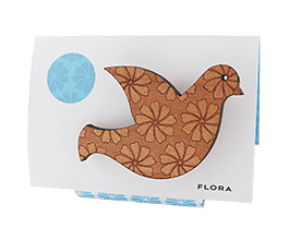 Dove brooch in Tasmanian Myrtle wood veneer with a delicate laser-engraved floral pattern of overlapping triangles